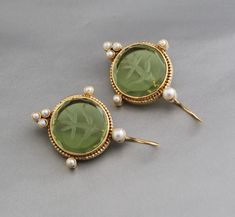 Description Gemstone - Olive Green Glass Material - Brass Gemstone Size - 18 mm Earring Height Including Hoop - 4 cm Earring Width - 2 cm Finish - Smooth and high polished with Little Oxide Antique Look. Note -The earrings are made to order, production day is about 3-5 working days. The one you receive may be slight different from the one in the picture due to handmade nature, but it will be almost same as in the above picture.These pieces are handcrafted from start to finish and have an imperfect handmade look.These earrings are the perfect addition to your collection. Our rings are meant to be classic enough for everyday wear or to give as a bridesmaid gift. You will receive the same piece as in the picture or identical. Since all gemstones are different from each other, I cannot guarant