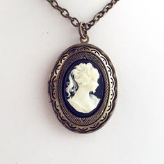 "Cameo Locket Necklace Classic Lady Woman Cameo Gift for Women -I make this necklace using an antique brass locket pendant and add a black and cream cameo -Pick any chain length in the dropdown menu, if the length you need is not listed, select \"custom\" and leave your desired chain length in the \"note to seller\" at checkout -Locket measures 1 3/8\" tall x 1\" across closed -Nickel free lead free alloy metal, resin cameo -Gift Boxed More of my Lockets: https://www.etsy.com/shop/lydiasvintage? Cameo Locket, Locket Vintage, Necklace Photo, Victorian Locket, Steampunk Victorian, Style Steampunk, Victorian Costume, Cameo Jewelry, Cameo Pendant