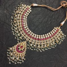 Beautiful Kundan Choker with White and Pink Kundan Stone combination like shown in picture with pearls stringing and Matching Stylist Earrings.Its earrings is about 2.5 Inch long with pearls hangings and Matching Mangtikka. *It's beautiful Ethnic Indian Wedding Necklace with Earrings. *Necklace and Earrings are same like shown in picture. *It will come with adjustable string which fits all Neck size. *Our all jewelry is made from semiprecious stones and beads. *WARRANTY: ITS GENUINE HANDMADE JEW Ceremonial Temple Jewelry Chandbalis With Stone Work, Bollywood Style Temple Necklace With Chandbali Stone Work, Bollywood Kundan Temple Necklace With Latkans, Heavy Kundan Chandbalis For Puja, Traditional Kundan Necklace With Stone Work For Ceremonial Use, Traditional Kundan Necklace With Stone Work For Ceremonial Occasions, Bollywood Chandbali Temple Necklace With Stone Work, Ceremonial Traditional Kundan Necklace With Stone Work, Heavy Traditional Kundan Necklace