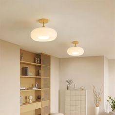 a living room filled with furniture and white walls