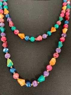 An amazing necklace from the 1960s. Can be worn in many ways Necklace made up of mixed colored and shape beads Sizing Length 124cm/49inches Plastic Beads, Chain Styles, Long Necklace, Lovely Gift, Classic Style, Multi Color, Favorite Jewelry, Necklace Lengths, Beaded Necklace