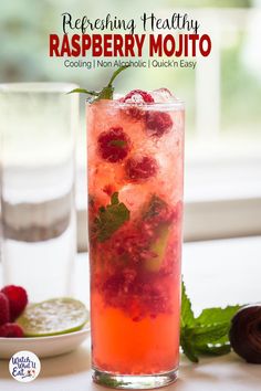 raspberry mojito in a tall glass with mint garnish