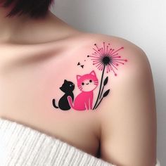 a woman with a cat and flower tattoo on her shoulder