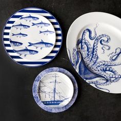 three plates with blue and white designs on them, one has an octopus in the center