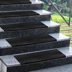 the steps are made of granite and have metal treads