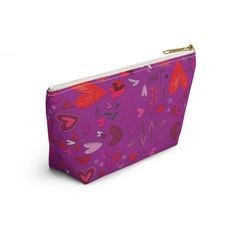 a purple pouch with hearts on it