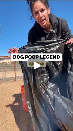 a woman standing next to a dog in a black bag with the words dog poop legend on it