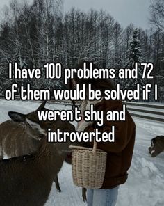 a person standing next to two deer in the snow with text that reads i have 100 problems