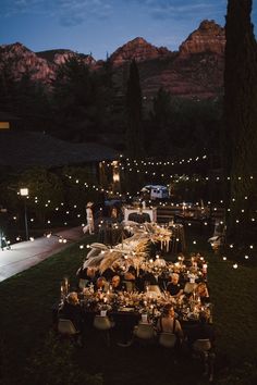 an outdoor dinner is set up in the evening