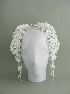 a white headpiece with flowers on it