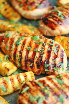 grilled chicken and pineapples with herbs on the grilling sheet, ready to be served