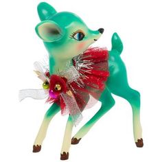 a green toy deer with a red dress on it's back