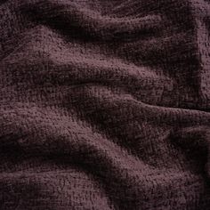 the texture of an old blanket is dark purple