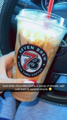 a person holding up a drink in their hand with the caption seven brain coffee