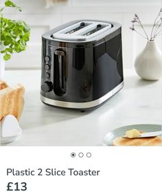 a black toaster sitting on top of a counter