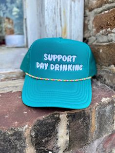 Stay cool and protected while showing your love for day drinking with our Support Day Drinking Foam Trucker hat. The foam front panel provides a comfortable fit and the mesh back allows for breathability. Perfect for outdoor events or everyday wear.100% Polyester Front / 100% Polyester Mesh Back Adjustable Snap OSFM - Adult (6 1/2 - 7 5/8) ships within 10 business days Green Adjustable Snapback Hat With Short Brim, Green Adjustable Snapback Hat, Adjustable Green Trucker Hat With Short Brim, Green Adjustable Trucker Hat With Short Brim, Fun Adjustable Green Hat, Support Day Drinking, Woman Hats, Lake Trip, Drinking Quotes