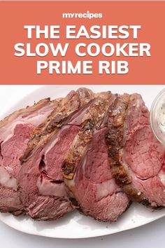 the recipe for slow cooker prime rib is shown on a white plate with sauce