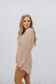 This is a pink long sleeve romper with a v neck and a keyhole back. The model is wearing a size medium. Feminine V-neck Jumpsuits And Rompers For Night Out, Feminine Spring Long Sleeve Jumpsuits And Rompers, Spring Long Sleeve Jumpsuits And Rompers For Night Out, Pink Long Sleeve Jumpsuits And Rompers For Spring, Pink Long Sleeve Jumpsuit For Night Out, Long Sleeve Jumpsuits And Rompers For Brunch, Long Sleeve Jumpsuits And Rompers For Spring Brunch, Chic Long Sleeve Jumpsuits For Brunch, Chic Long Sleeve Jumpsuits And Rompers For Brunch