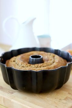 a bundt cake sitting on top of a wooden cutting board