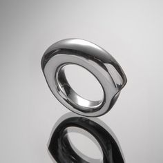 "* Handmade Round-Ring made of solid 925 Sterling Silver, impressive design & comfortable to wear for women, all sizes possible. * It's weight is 42 g. The width on the top part is 0.4 inches, the band is 0.3 inches. * I named this ring \"Cleopatra\". We create it by hand made of 925 sterling silver. Cleopatra looks absolutely stunning when you wear it while it is still totally comfortable. The shape on top is a round circle, while it is flattened on the sides. * You have the choice between a finesilver plating or 18k gold or 18k rosegold plating. The plating is very thick and of such a high quality that it will last for a lifetime. * This special pieces of jewellery comes in a beautiful box together with a jewelry polishing cloth Please note: in case of a return the buyer bears the costs Modern Sterling Silver Rings With Polished Finish, Elegant Sterling Silver Dome Ring, Modern Rings With Polished Finish And Round Band, Modern Open Ring With Shiny Finish, Elegant Sterling Silver Ring, Luxury Silver Rings With Polished Finish, Silver Signet Ring With Polished Finish, Elegant Silver Dome Ring, Luxury Silver Ring With Shiny Finish