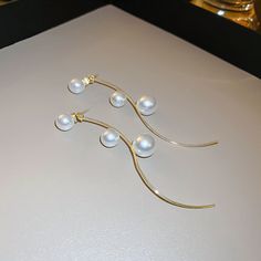 ✦ Elevate your elegance with our classy long drop earrings, featuring a timeless pearl design that exudes sophistication. Crafted for weddings and engagements, these earrings are the epitome of refined grace, making them a perfect accessory for your special day. The long drop silhouette adds a touch of grandeur, ensuring you shine with timeless allure. The lustrous pearls create a classic and enduring accessory that complements bridal ensembles with poise. Let these earrings be a symbol of everl Pearl Long Earrings, Long Pearl Earrings, Elegant Gothic, Engagement Celebration, Basic Jewelry, Crystal Hoop Earrings, Nose Rings Hoop, Long Drop Earrings, Pearl Design