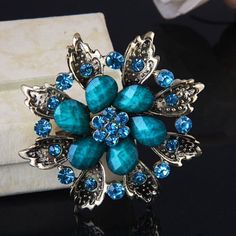 "GB211 Turquoise Glass Rhinestone Brooch Pin Gold 2.5\" Size: 2.5\" This item is not an applique it is a metal crystal brooch with a pin attached." Wedding Brooch Bouquets, Brooch Men, Gold Alloys, Turquoise Glass, Brooch Jewelry, Crystal Brooch, Pin Jewelry, Rhinestone Brooches, Vintage Rhinestone