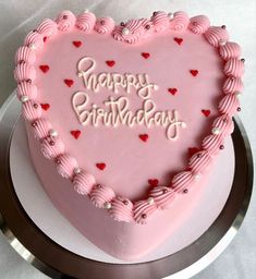 a heart shaped birthday cake with the words happy birthday written on it