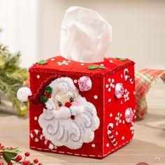 a tissue box with a santa clause on it