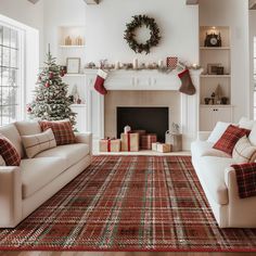 a living room filled with furniture and a fire place covered in christmas decorations next to a fireplace