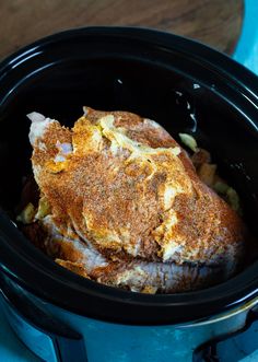 an open crock pot with some food in it