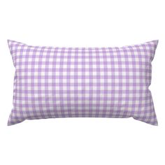 a blue and white gingham pillow on a white background