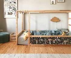 a child's bed with an animal theme on it