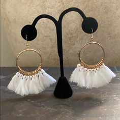 Details Are New Never Worn Brand: Candy Did It! Gold Plated 8 White Tassels On Each Earring Hook Earrings Very Light Weight They Hang At The Perfect Length Measure Approx 3.5” Long 1.5” Wide Across The Circle In New Condition No Defects One Of My Most Popular Earring Trendy White Tassel Earrings For Summer, White Dangle Tassel Earrings For Party, Trendy White Tassel Drop Earrings, White Tassel Earrings For Pierced Ears Party, Bohemian White Tassel Earrings For Pierced Ears, White Tassel Dangle Earrings, Elegant White Tassel Earrings, Elegant White Summer Tassel Earrings, White Dangle Tassel Earrings As Gift