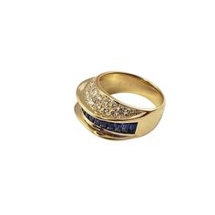 two gold rings with blue and white stones on top, one is in the shape of a ring