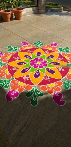 a colorfully painted flower design on the ground