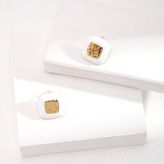 Introducing our Sterling Silver Square Drop Glaze Stud Earrings, where modern design meets classic elegance. Contemporary Square Design: These earrings feature sleek and minimalist square-shaped studs, adding a touch of modern sophistication to any outfit. The clean lines and geometric shape make them perfect for both casual and formal occasions.Glaze Finish: Each stud is adorned with a glossy glaze finish, adding a subtle shine and depth to the design. The glaze creates a smooth and polished surface, enhancing the visual appeal of the earrings and catching the light beautifully.Sterling Silver Construction: Crafted from genuine sterling silver, these earrings offer durability, shine, and hypoallergenic properties for sensitive ears. Stud Earrings Style: The stud earrings style provides a