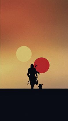 the silhouette of a person with a dog in front of an orange and red sunset