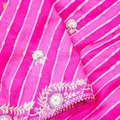 Experience the pinnacle of elegance with our Pure Tussar Silk Saree, a masterpiece that marries the timeless artistry of Aari and Pearl Embroidery from Jaipur with the enchanting Leheriya tie and dye craft—a heritage deeply rooted in the vibrant city of Jaipur. In a resplendent Pink Leheriya hue, this saree is poised to be a stunning addition to your collection. Fabric: Pure Tussar Silk Craftsmanship: Aari and Pearl Embroidery - Jaipur's Embroidery Marvel Leheriya Pattern: An Artistry of Dancing Traditional Silk Sharara With Dori Work, Traditional Tissue Silk Sharara With Cutdana, Festive Silk Traditional Wear With Dori Work, Traditional Raw Silk Sharara With Dori Work, Festival Silk Thread Sharara, Festive Silk Thread Sharara, Transitional Silk Saree With Dori Work, Festive Silk Thread Sharara With Traditional Drape, Silk Unstitched Suit With Dori Work In Traditional Drape