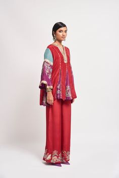 Auburn red applique embellished habutai silk short godet kurta, wide leg pants & teal dupatta. From Aisha Rao's Kinfolk collection. DELIVERY TIMEPlease allow 6-8 weeks for your outfit to arrive. FABRIC DETAILSSilk Professional cleaning only. Red Silk Anarkali Lawn Suit, Red Silk Lawn Suit With Chikankari Embroidery, Red Silk Lawn Suit With Dabka, Red Silk Lawn Suit For Eid, Red Chanderi Palazzo Set With Dabka Detail, Silk Anarkali Pant Set For Diwali, Red Sharara With Dabka For Navratri, Red Silk Lawn Suit For Festive Occasions, Red Silk Lawn Suit With Traditional Drape