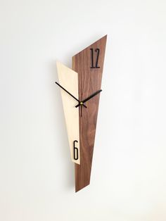 a wooden clock with the number six on it