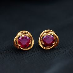 Product Details Designed with elegance, these Swirl Stud Earrings crafted in Solid Gold are Adorned with Round Cut Rhodolite Solitaire to complement your attire for special occasions. Product Information SKU SHP-EARRINGS062196639 Length 9 mm Width 9 mm Height 3.7 mm Weight 2.02 gm RHODOLITE INFORMATION No.of Stones 2 Pieces Total Weight 1.20 Carat Dimension(approx) Round-5X5 mm-2 Pcs Color Red Cut Brilliant cut Shape Round Setting Type Prong-Setting Quality Grade AAA View More Small Earrings Gold, Gold Earrings Models, Gold Earrings Wedding, Bridal Diamond Jewellery, Daughter Jewelry, Gold Jewelry Stores, Gold Rings Fashion, Gold Jewelry Simple, Gemstone Stud Earrings