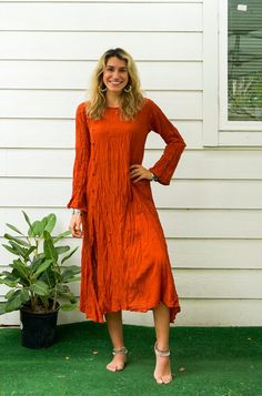 Step into effortless style with this Raw Natural Crinkled Cotton Long Sleeve Maxi Dress. Perfect for summer, this bohemian-inspired dress features a minimal design with a touch of elegance. This bohemian-style maxi dress is made from raw natural crinkled cotton, providing a soft and breathable feel. The asymmetrical hemline and front leg split add a stylish touch, while the long sleeves make it suitable for various occasions. The dress features coconut buttons, enhancing its natural and rustic c Summer Bohemian Linen Dress, Bohemian Linen Summer Dress, Solid Color Bohemian Linen Dress For Spring, Solid Color Bohemian Long Sleeve Maxi Dress, Bohemian Long Sleeve Linen Dress For Summer, Bohemian Long Sleeve Linen Summer Dress, Bohemian Long Sleeve Solid Maxi Dress, Summer Bohemian Long Sleeve Linen Dress, Spring Summer Dress With Crinkle Texture