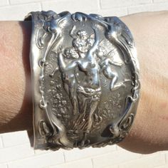 Thank You For Looking At This One Of A Kind Wide Cuff Bracelet Which Is Repurposed With Rare Wallace Sterling Silver Repousse That Is From The Turn Of The 19th Century. This Is Solid Sterling Silver That Was Tested 925 This Is Similar To The Spoon Ring Type Jewelry -Repurposed And Up Cycled And Forged All Edges Are Smooth To The Touch Wallace Stamp On Interior 49.6 Grams 2.25 Width Fits Size Large Wrist 7-8 Inch Wrist You Can Wear It If You Have A 6.5 But It Wont Be Snug Its Slightly Adjustable Silver Goddess, Cherub Angel, Wide Cuff Bracelets, Spoon Ring, Spoon Rings, Wide Cuff, Types Of Rings, Antique Art, Womens Jewelry Bracelets