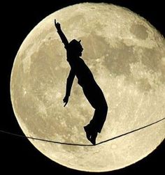 the logo for boa noire with a person on a tightrope in front of a full moon