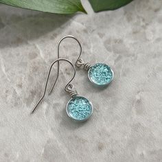 "Light Blue Earrings, Handmade Glass Boho Jewelry, Sparkly Blue Dainty Earrings Hippie Jewelry Unique Gift for Her, Tiny Cute Earrings ✨Glass: Transparent Light Aqua Tint art glass and dichroic glass. Glass really comes to life in the sun too! They are little sun catchers!! 🤍These earrings are made with Sterling Silver wire and it's Nickel Free! 🍃See more Weathered Heather Jewelry Here: https://weatheredheather.etsy.com 🌟Handmade Art Glass Jewelry by Weathered Heather in Central NY! 🎁I packa Turquoise Glass Earrings For Gift, Blue Hypoallergenic Glass Earrings, Blue Wire-wrapped Round Earrings, Blue Wire Wrapped Round Earrings, Blue Wire Wrapped Glass Earrings, Blue Wire-wrapped Glass Earrings, Blue Glass Wire Wrapped Earrings, Blue Round Glass Earrings, Light Blue Glass Jewelry For Gifting