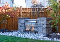 an outdoor fireplace in the middle of a yard