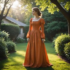 【RENAISSANCE INSPIRED ORANGE GOWN】: This Renaissance-inspired gown features a classic lace-up front with elegant puffed long sleeves, exuding vintage charm and sophistication. The gown's fitted bodice beautifully accentuates the waist, while the flowing skirt adds a graceful, timeless appeal. 【PREMIUM FABRIC】: Made from soft and breathable fabric, this gown offers exceptional comfort for extended wear. The high-quality stitching ensures durability and lasting elegance. 【UNIQUE DESIGN】: The lace- Red Fitted Vintage Medieval Dress, Fitted Red Medieval Dress With Historical Design, Red Historical Costume Dress, Orange Medieval Dress, Red Long Sleeve Medieval Dress, Orange Gown, Designer Image, Medieval Dress, Historical Dresses