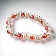 Beautiful Faceted Gold And Red Crystal Stretch Bead Bracelet. Can Be Worn For A Special Occasion, To The Office, Or To Jazz Up A Casual Outfit. Great For Gifts! Approximately 1/2" Wide. The Stretch Cord Will Stretch To Fit, But Then Bounce Back To Its Original Size. Red Crystal Bracelet With Spacer Beads, Red Beaded Bracelets With Spacer Beads For Party, Red Faceted Beaded Bracelets For Gifts, Red Beaded Crystal Bracelet For Party, Red Faceted Round Bead Bracelets, Red Faceted Round Bracelets, Handmade Red Crystal Bracelet With Round Beads, Elegant Red Crystal Bracelet With 8mm Beads, Elegant Red Beaded Stretch Bracelet