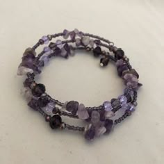 Handmade Coil Bracelet B028 Purple And Black Bracelet, Purple Bracelet Ideas, Summer Oc, Braided Bead Bracelet, Lavender Bracelet, Purple Bracelets, Solar System Bracelet, Purple Beaded Bracelets, Beaded Memory Wire Bracelets