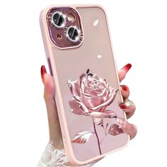 a woman holding up a pink phone case with a rose on the front and side